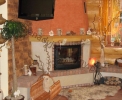 Wnętrza domów z bali - Kominki